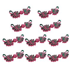 six pairs of pink and green hair clips on a white background with clippings in the shape of flowers