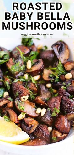 roasted baby bella mushrooms in a white bowl with lemon wedges and parsley