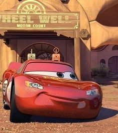 the character cars from disney pixar are in front of an entrance to a building