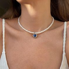 This choker is made from natural freshwater pearls. The pendant with a blue crystal looks very striking. The necklace is a perfect gift for a friend. Its design adds a romantic touch to the look and helps create an extraordinary appearance. Beads: Natural freshwater pearls. Clasp: Stainless Steel. Pendant: Copper, Glass Pendant size: 1,7cm*1,6cm. Necklace length 39сm+5cm. 🔸more from us🔸 https://www.etsy.com/shop/DoraJewelryAccessory Blue Stone Pendant, Romantic Necklace, Real Pearl Necklace, Copper Glass, Necklace Heart, Gift For Woman, Real Pearls, Stone Pendant Necklace, Stone Heart