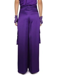 Versace's Wide-Leg Trousers from their SS23 collection. Designed to make a bold statement, these trousers feature a vibrant orchid-purple hue, embodying the experimental and dramatic themes of the collection.Key Features:- Wide-Leg Cut: Offers a roomy fit over the leg while maintaining a close fit at the waist for a flattering silhouette.- Material: Crafted from 100% viscose, a midweight non-stretch fabric, ensuring both comfort and a luxurious feel.- True to Size: These trousers fit true to siz Purple Bottoms For Evening In Spring, Purple Bottoms For Spring Evening, Purple Evening Bottoms For Spring, Elegant Purple Pants For Party, Elegant Purple Bottoms For Party, Elegant Purple Party Bottoms, Purple Formal Full-length Bottoms, Purple Straight Pants For Formal Occasions, Formal Full-length Purple Bottoms