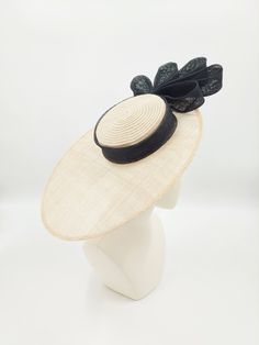 Classic boater in natural and black. Chic Fitted Boater Hat With Flat Crown, Black Spring Hat With Flat Crown, Black Flat Crown Hat For Spring, Elegant Black Hat With Flat Crown, Black Top Hat For Kentucky Derby With Flat Crown, Black Top Hat With Flat Crown For Kentucky Derby, Black Summer Hat With Flat Crown, Elegant Natural Boater Hat For Garden Party, Elegant Spring Top Hat With Flat Crown