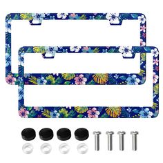 two blue flowered license plates with screws and four studs on each side