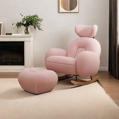 a pink chair and footstool in a living room