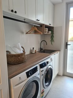 a washer and dryer in a small room