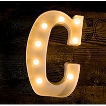 the letter c is lit up with light bulbs