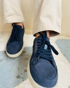 These Men's Navy Blue Sneakers offer a sleek blend of style and versatility. The premium leather upper in a rich navy hue pairs perfectly with the contrasting white sole for a modern, clean look. Designed for comfortable everyday wear, these versatile casual footwear options are perfect for everything from weekend outings to casual Fridays at the office. Experience the ideal balance of fashion and function with these essential sneakers. Sporty Navy Sneakers With Stitched Sole, Navy Casual Sneakers With Stitched Sole, Navy Textured Sole Slip-on Sneakers, Navy Slip-on Sneakers With Textured Sole, Modern Navy Sneakers With Round Toe, Navy Casual Custom Sneakers With Rubber Sole, Navy Low-top Sneakers With Textured Sole, Modern Blue Sneakers With Stitched Sole, Casual Navy Sneakers With Contrast Sole