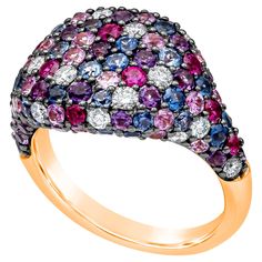 A fashionable and rare style of ring, showcasing multi-row of round brilliant cut gemstones and diamonds set on a creative design weighing 3.72 carats total. Vibrant amethysts weigh 0.59 carat, pink sapphires weigh 0.88 carat, rubies weigh 0.52 carat, blue sapphires weigh 1.21 carats, and diamonds weigh 0.52 carat. Set on a shared-prong setting with a convex domed design. Made with 18K rose gold. Size 6.5 US, resizable upon request. Roman Malakov is a custom house, specializing in creating anything you can imagine. If you would like to receive a special quote on a custom piece, please message or call us. Diamond Fashion Rings, Custom House, Domed Ring, Fashion Ring, Diamond Fashion, Diamond Sizes, Side View, Pink Sapphire, 18k Rose Gold