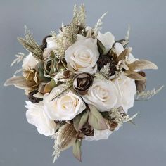 a bridal bouquet with white and brown flowers