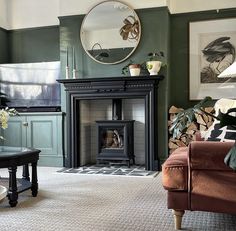 a living room filled with furniture and a fire place