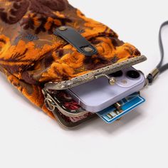 With a nod to the Victorian era, MCW’s freshly combines the classic and elegant design of the traditional carpet bag with a textural and tactile twist.The main body of the functional phone case is made with rich chenille carpet, cotton floral canvas, and brass clasp with double kiss lock. With the width 4.15" and height 8.60" it can easily hold phones of any sizes (max phone width to 4"), with the leather wrist strap that comes with the bag. There are two mini rings at both sides of the clasp and it will come with a 60" detachable chain with hooks so this bag could be switched to crossbody.Both exterior and inside divider are padded with 100% cotton canvas, providing complete protection for the stuffs. This Victorian Carpet Case is designed to hold cell phone, passport, cards, reading glas Victorian Carpet, Ancient World Maps, Large Travel Bag, Work Tote Bag, Mens Travel, Mens Travel Bag, Work Tote, Carpet Bag, Dog Carrier