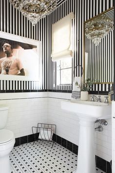 a bathroom with black and white striped walls