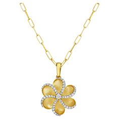 This stunning pendant features a meticulously carved flower design that exudes natural beauty and grace. The pendant is further accentuated with a sparkling halo of pave-set diamonds that surround the edges, adding a touch of luxury and glamour. Made from high-quality 14k yellow gold, this pendant is a true masterpiece of craftsmanship, perfect for adding a touch of elegance and sophistication to any outfit. Whether for a special occasion or everyday wear, this pendant is sure to become a cherished piece in your jewelry collection. 14KT:5.013g, Diamond:0.5ct Beauty And Grace, On The Edge, Halo Diamond, The Edge, Flower Design, Flower Designs, Natural Beauty, Halo, Jewelry Collection