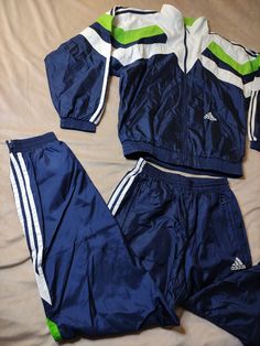 Vintage_ NEW 80s Adidas Tracksiute Pants and Jacket Set Windbreake Jacket Size M This is a beautiful set of Adidas pants and windproof jacket. The set is in perfect condition, like new, looks beautiful with a vibrant green color. I heartily recommend! The outfit is brand new with tags! Size from tag: GB30 / 40 USAM Dimensions: Jacket total length: 70 cm chest 60 cm: in the hips: 62 cm sleeve from the collar: 77 cm Trousers waist: min: 35 max 49 inside leg: 79 cm total length of trousers: 106 cm 80s Adidas, Adidas Hose, Cute Nike Outfits, Adidas Joggers, Adidas Tracksuit, Adidas Windbreaker, Adidas Vintage, Windproof Jacket, 1980s Fashion