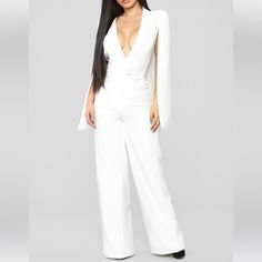 Fashion Nova Woman Of Many Talents Jumpsuit Color: Ivory Size: Xs Nwt Cape Sleeve Jumpsuit Wide Leg Deep V Neck Zipper Front Single Button Closure Lined Moderate Stretch 34 Inseam Self: 100% Polyester Lining: 100% Polyester Fitted White V-neck Jumpsuits And Rompers, Elegant White Long Sleeve Jumpsuit, White Long Sleeve Pantsuit For Party, Elegant White V-neck Jumpsuit, Elegant White Jumpsuits And Rompers For Night Out, White Long Sleeve Jumpsuits And Rompers For Evening, White Long Sleeve Jumpsuits For Evening, White V-neck Jumpsuits And Rompers For Formal Occasions, White Long Sleeve Jumpsuits For Night Out