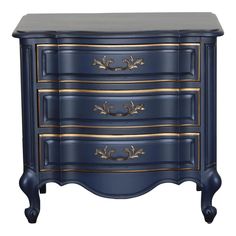 a blue dresser with gold trimmings on the top and bottom drawers, against a white background