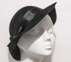 Lauren Cloche Hat.  Classic 30's swagger by And They Loved Hats. Glamorous and stylish. Black cloche hat is sculpted from a buttery soft textured black wool fur felt. A band of pure silk ribbon encircles the crown with a silk bow decoration on the side. Very chic.  YOUR SIZE inches or centimeters 21" | 53-54cm 21.5" | 54-55cm 22" | 56cm 22.5" | 57-58cm 23" | 58-59cm 23.5" | 60cm 24" | 61 Place a tape measure on your forehead just above the eyebrow. Fit it around your head, ensuring that the wide Cloche Hats, Silk Bow, Derby Hat, Century Clothing, Love Hat, Wedding Ribbon, Cloche Hat, Derby Hats, Silk Ribbon