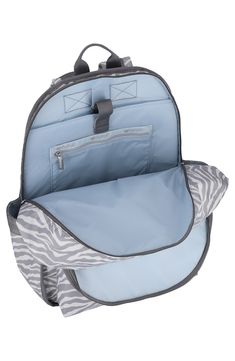 Dual compartments and extra pockets create a ton of room in an everyday backpack that secures your belongings in style. 16.1"H x 13"W x 4.9"D Top zip closure Textile Imported On-the-go Softback Backpack With Anti-theft Pocket, Casual Laptop Backpack For Trips, Anti-theft Backpack Travel Accessories, Casual Backpack Diaper Bag With Zipper Pocket, Casual Backpack Diaper Bag, School Laptop Bag With Anti-theft Pocket, Casual Diaper Backpack With Zipper Pocket, Trip Backpack Luggage With Zipper Pocket, Backpack Luggage With Zipper Pocket For Trips