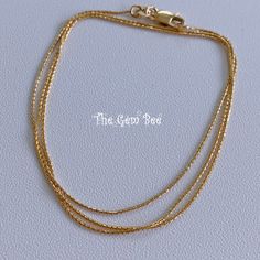 "DESCRIPTION: Thank you for coming in! Genuine 14K SOLID YELLOW GOLD necklace with wheat chain links and lobster clasp. THEY ARE STAMPED WITH \"14KT Italy\", but we could not show it clearly in the pictures. Adjustable up to 22\" length! Quite hefty and strong! You'll get 1 necklace per winning! DIMENSION: 0.91mm wheat chain, 4mmx8.5mm lobster clasp. WEIGHT: Appr. 3.1 gram MATERIAL: 14K Yellow Gold" Classic Gold Chain Bracelet With Wheat Chain, Gold Wheat Chain Bracelet Gift, Gold Wheat Chain Bracelet As Gift, Classic Gold Wheat Chain Bracelet, Yellow Gold Bracelets With Wheat Chain As A Gift, Yellow Gold Double Strand Cable Chain Jewelry, Dainty Gold Bracelet With Cable Chain, Dainty Yellow Gold Bracelet With Cable Chain, 14k Yellow Gold Snake Chain Bracelet