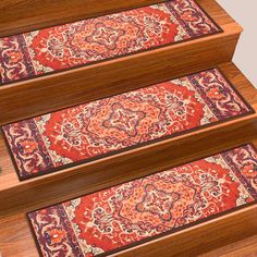 three red rugs are on the stairs