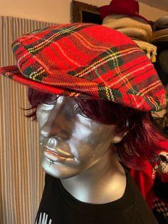 This nice red plaid wool cap is made by Imperial Caps Inc.  It has a snap front, and the back overlaps with velcro for adjustability.  Very stylish addition for the season.  As is, no returns Plaid Cap One Size Fits Most, Casual Red Flat Cap, Red Flat Cap For Fall, Plaid Short Brim Winter Hat, Winter Plaid Hat With Short Brim, Plaid Short Brim Hat For Winter, Adjustable Plaid Cap, Casual Plaid Flat Cap, Classic Plaid Hat For Fall