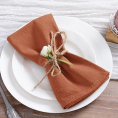 the napkins are tied with twine and placed on top of eachother