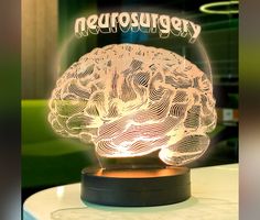 a glass ball with a glowing brain on it that says kregeldrousn