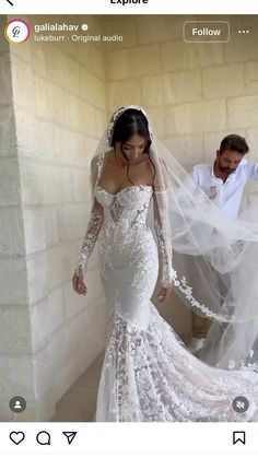 a woman in a wedding dress standing next to a man wearing a white shirt and veil