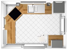 an overhead view of a kitchen and living room in a tiny apartment with white tile flooring