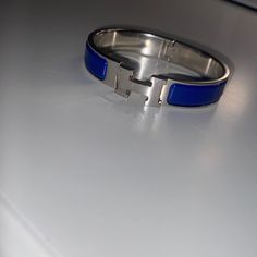 Narrow Bracelet In Enamel With Palladium-Plated Hardware. Used Bracelet, Good Condition. Discontinued Royal Blue Color. Made In France Circumference: 7” | Width: 0.47” Hermes Blue, H Bracelet, Hermes Jewelry, Royal Blue Color, Womens Jewelry Bracelets, Made In France, Royal Blue, Color Blue, Blue Color