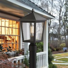 a lamp post in front of a house