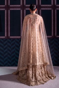 Brand: NeeshayCollection: Neeshay Parinaaz Unstitched Wedding Formal CollectionFabric: Net PRODUCT DETAILS: Net Embroidered And Hand Embellished Front Body (1 Pc) Net Embroidered And Hand Embellished Back Body (1 Pc) Net Embroidered And Hand Embellished Sleeves (0.66 M) Net Embroidered And Hand Embellished Sleeves Motif (2 Pcs) Net Embroidered Front Kalian (9 Pcs) Net Embroidered Back Kalian (9 Pcs) Net Embroidered Dupatta (2 M) Net Embroidered Dupatta Pallu (2 Pcs) Plain Dyed Rawslik (5 Yards) Designer Embroidered Anarkali Wedding Dress, Gold Anarkali Dress For Ceremonies, Wedding Gown With Intricate Embroidery In Raw Silk, Anarkali Sharara With Sheer Dupatta For Wedding, Raw Silk Gown For Wedding On Eid, Designer Wedding Dress With Resham Embroidery For Eid, Raw Silk Gown For Wedding And Eid, Floor-length Sharara With Intricate Embroidery For Weddings, Traditional Tissue Silk Wear With Intricate Embroidery For Wedding