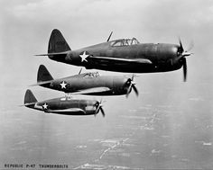 two planes flying side by side in the sky with stars on their wings and propellers