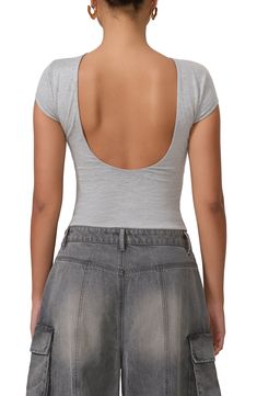 A cropped top presents as simple and standard from the front but serves seriously sultry vibes in the back. 18 1/2" length (size Medium) Boat neck lined Short sleeves Open back 95% rayon, 5% spandex Machine wash, tumble dry Imported Summer Low-cut Crop Top With Built-in Bra, Fitted Low-cut Top With Built-in Bra, Spring Scoop Neck Crop Top With Built-in Bra, Scoop Neck Crop Top With Built-in Bra For Spring, Chic Scoop Neck Crop Top With Built-in Bra, Fitted Crop Top With Built-in Bra And Scoop Back, Chic Seamless Low-cut Crop Top, Fitted Trendy Crop Top, Bra Friendly Backless Crop Top For Night Out