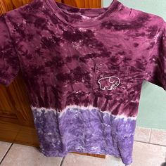 a purple and white tie dye shirt with a kansas state logo on it