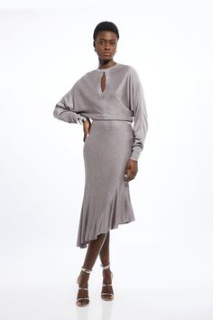 Elevate Your Evening Wardrobe With Our Midi Dress, With A Unique Fit That Is Relaxed At The Bodice Then Cinches At The Waist To A Figure Hugging Fit, As Well As A Playful, Asymmetric Hemline. Style It With Statement Strappy Heels For An Occasion Look That Is Guaranteed To Turn Heads Wherever You Step. Viscose Blend Slinky Jacquard Asymmetric Knit Midi Dress Statement Asymmetric Hemline Long, Wide Sleeves Relaxed Fit Bodice Figure Hugging Skirt Keyhole Accent At Bust