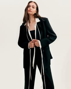 A deep affection for refined and timeless fashion influences the craftsmanship and quality of this style. Made from suit fabric, these black pants are made in a high-rise style to lengthen legs. For a completely stylish look pair your pants with a black boyfriend blazer. Details: Material: Suit fabric Fabric composition: 100% Polyester Silhouette: Relaxed Length: 43.7 inches / 111 cm Lining: High waist straight fit Model is 179 cm / 82-62-93, wearing size S Average dress weight 2.44 lbs / 1.11 k Chic Formal Tuxedo For Fall, Chic Fall Tuxedo For Formal Occasions, Chic Fall Tuxedo With Suit Collar, Chic Tailored Pantsuit With Suit Collar, Chic Pantsuit With Structured Boning For Fall, Chic Fall Pantsuit With Structured Boning, Tailored Chic Formal Pantsuit, Chic Tailored Formal Pantsuit, Chic Formal Pantsuit