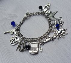 Supernatural Charm Bracelet Adjustable Nickel-free Metal Charms, Adjustable Novelty Charm Bracelet With Lobster Clasp, Novelty Nickel-free Metal Charm Bracelet, Personalized Black Metal Charm Bracelet, Nickel-free Themed Stainless Steel Jewelry, Themed Nickel-free Stainless Steel Jewelry, Adjustable Hypoallergenic Metal Charms, Black Metal Charm Bracelet, Nickel Free Black Metal Charm Bracelet