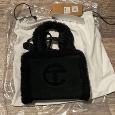 New With Tags From Nordstrom. Will Ship Quickly.Has Crossbody Strap. Designer Black Bags For Winter, Telfar Ugg, Telfar Black, Ugg Purses, Ugg Bag, Black Uggs, Faux Leather Top, Chiffon Shorts, Pool Bags