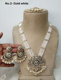 *Light Weight Gold Rani Haar Necklace Set. *No.1- Gold white rani haar *Haar length: 11 inches (including pendant) *Pendant Breadth- 2.2 inches *Earrings length: 1.9 inches  (with drops) ;   *earrings Width: 1 inches White Round Necklaces For Festivals, White Long Bridal Necklace Gift, White Kundan Jewelry For Eid, White Necklaces For Wedding And Eid, White Necklace For Wedding And Eid, White Kundan Round Necklaces, White Kundan Necklace For Eid Gift, White Kundan Necklace For Festive Occasions, Elegant White Necklace For Eid