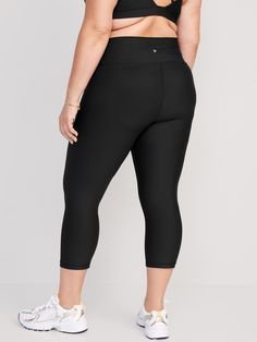 elasticized waist breathable go-dry wicks moisture sits at belly button fitted hits mid-calf 21" inseam models are approx.  5'9" and wear sizes s (4), l (12), and xl (18)machine wash according to the care instruction label Black Compression Pants With 5-inch Inseam, Casual Black Bottoms For Pilates, Casual Black Yoga Pants With Contoured Waistband, Black Bottoms With Elastic Waistband For Pilates, Gym Bottoms With 4-way Stretch In Capri Length, Gym Capri-length Bottoms With 4-way Stretch, Black Compression Moisture-wicking Bottoms, Gym Capri Bottoms With 4-way Stretch, 4-way Stretch Capri Bottoms For Gym