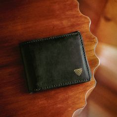 Limited Edition Luxury Bifold Wallet In Collaboration with Jack Andrews Vintage Leather Luxury Brand We are excited to bring in this collaboration with Jack Andrews—a new brand in the vintage leather luxury space. It brought us into our only and limited edition black full grain leather collection in the Buffalo Jackson product mix. Perfectly sophisticated, but not too stuffy. Details in all the right places. Take as your foundation the enduring classic style of a men’s bifold wallet. Now build o Vintage Leather Wallet With Rfid Blocking, Everyday Vintage Wallet With Rfid Blocking, Vintage Leather Wallets For Everyday, Vintage Black Trifold Wallet For Everyday Use, Classic Bifold Wallet With Leather Patch, Vintage Leather Trifold Wallet For Everyday, Black Leather Trifold Wallet For Everyday, Everyday Black Trifold Wallet With Smooth Grain, Luxury Black Trifold Wallet For Everyday Use