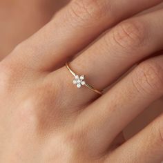 One of our latest designs, our new dainty flower design with natural round diamonds is truly a piece to enjoy every day.★ Ring Features• Gold Kt: 14K Solid Gold (All rings are stamped for authenticity)• Available Gold Colors: Yellow Gold, White Gold, Rose Gold• Total Diamond Weight: 0.12 carat• Diamond Color-Clarity: G Color VS2/SI1 Clarity• Band Width: 1.2 mm• Face Dimensions: 5.8 mm by 5.8 mm / 0.23 Inch by 0.23 Inch Dainty Flower Engagement Ring, Simple Floral Engagement Ring, Gold Ring With Small Diamond, Diamond Daisy Ring, Dainty Flower Ring, Small Diamond Ring Design Simple, Daisy Diamond Ring, 14k Gold Flower Diamond Ring, 14k Gold Flower Diamond Ring Fine Jewelry