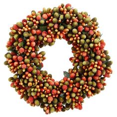 a wreath with orange and green berries hanging from it's center, in front of a white background