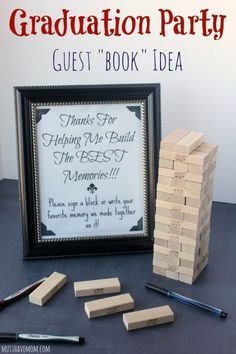 the graduation party guest book idea is displayed next to some wooden blocks and pencils