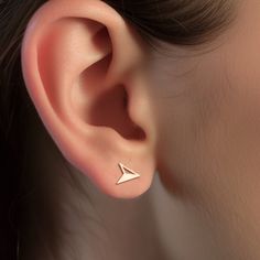 Discover the perfect blend of style and symbolism with our Compass Arrow Earrings. Crafted with precision and available in your choice of gold filled, sterling silver, or rose gold filled, these earrings are a symbol of direction, purpose, and a fashion-forward mindset.   The elegant compass arrow design makes a subtle yet powerful statement, representing the journey, exploration, and always moving forward. These earrings are a perfect accessory for those who forge their path. 🧭 * We use the Hi Triangle Shaped Single Earring As A Gift, Triangle Single Earring As Gift, Nickel-free Triangle Earrings As Gift, Hypoallergenic Triangle Earrings For Gift, Triangle Pierced Earrings As Gift, Triangle Earrings As Gift, Triangle Pierced Earrings Gift, Modern Rose Gold Cartilage Earrings For Gift, Modern Nickel-free Rose Gold Earrings