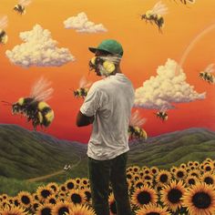 a man standing in front of a field of sunflowers with bees flying around