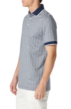 Patterned in crisp geometries, this polo made of cotton and sustainably produced lyocell brings comfort and polish to all your favorite looks. 28" length Button half-placket Spread collar Short sleeves 70% cotton, 30% Tencel® lyocell Tencel lyocell is a sustainably produced fiber made with closed-loop processing Machine wash, dry flat Imported Navy Cotton Polo Shirt, Navy Cotton Polo Shirt For Spring, Spring Navy Cotton Polo Shirt, Modern Cotton Polo Shirt With Johnny Collar, Modern Cotton Polo Shirt With Placket, Modern Cotton Polo Shirt With Relaxed Fit, Modern Relaxed Fit Cotton Polo Shirt, Modern Fitted Cotton Polo Shirt, Cotton Jacquard Knit Collared Polo Shirt