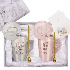 three coffee mugs in a gift box with gold handles