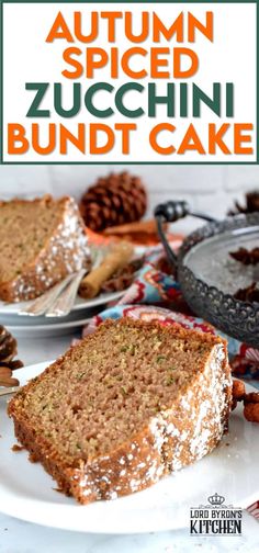 an autumn spiced zucchini bundt cake on a white plate with pine cones